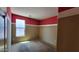 Empty bedroom with a large window and two-tone paint at 4432 W Pleasant Ln, Laveen, AZ 85339