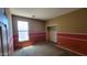 Empty bedroom with a large window and two-tone paint at 4432 W Pleasant Ln, Laveen, AZ 85339