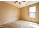 An empty bedroom with a ceiling fan offers a blank canvas at 4432 W Pleasant Ln, Laveen, AZ 85339