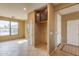A dining area with tiled floors and a large window offering ample natural light at 4432 W Pleasant Ln, Laveen, AZ 85339