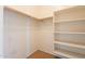 A walk-in closet featuring rod shelving and built in shelving at 4432 W Pleasant Ln, Laveen, AZ 85339