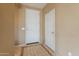 Open entry foyer boasts ceramic tile flooring, white doors, and neutral paint at 4432 W Pleasant Ln, Laveen, AZ 85339