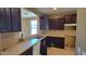 Kitchen features light colored countertops and dark cabinets at 4432 W Pleasant Ln, Laveen, AZ 85339