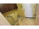 Laundry area with tile floor, cabinet, and hook ups for laundry machines at 4432 W Pleasant Ln, Laveen, AZ 85339