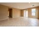 Living room features tile floors and sliding glass doors to back patio at 4432 W Pleasant Ln, Laveen, AZ 85339