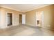This main bedroom has neutral walls and multiple doors that lead to a closet and bathroom at 4432 W Pleasant Ln, Laveen, AZ 85339