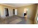 Spacious main bedroom with neutral walls, carpeting, and access to bathroom and closet at 4432 W Pleasant Ln, Laveen, AZ 85339