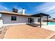 Back exterior view of the home with a patio, pergola, and a pool at 4510 N 105Th Ave, Phoenix, AZ 85037