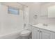 Bright bathroom featuring a shower-tub combo with tile surround, and a vanity at 4510 N 105Th Ave, Phoenix, AZ 85037