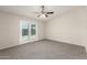 Bright bedroom with neutral walls and a ceiling fan at 4510 N 105Th Ave, Phoenix, AZ 85037