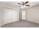 Bedroom with a large closet and a ceiling fan at 4510 N 105Th Ave, Phoenix, AZ 85037