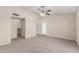 Large bedroom with an open closet and neutral carpeting at 4510 N 105Th Ave, Phoenix, AZ 85037