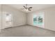 Spacious bedroom featuring a ceiling fan and access to the pool area at 4510 N 105Th Ave, Phoenix, AZ 85037