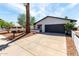Beautiful single-story home featuring desert landscaping and a large driveway leading to the garage at 4510 N 105Th Ave, Phoenix, AZ 85037
