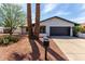 Home exterior featuring desert landscaping and a covered front porch at 4510 N 105Th Ave, Phoenix, AZ 85037
