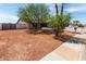 Charming single-story home featuring a low-maintenance desert landscape and mature trees at 4510 N 105Th Ave, Phoenix, AZ 85037