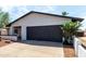 Front view of the garage, landscaping and partial front exterior of the home at 4510 N 105Th Ave, Phoenix, AZ 85037