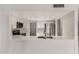 Modern kitchen featuring white cabinets, stainless steel appliances, and a breakfast bar at 4510 N 105Th Ave, Phoenix, AZ 85037