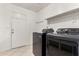Laundry room featuring full size washer and dryer and access to the exterior at 4510 N 105Th Ave, Phoenix, AZ 85037
