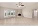 Bright living room featuring tiled floors, and french doors leading to a patio at 4510 N 105Th Ave, Phoenix, AZ 85037