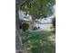 A charming backyard with a covered patio and lush green lawn, perfect for outdoor relaxation and entertaining at 4513 E Grovers Ave, Phoenix, AZ 85032