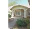Inviting front entry with decorative columns and lush landscaping at 4513 E Grovers Ave, Phoenix, AZ 85032