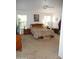 Serene main bedroom suite with natural light, ceiling fan and comfortable furnishings at 4513 E Grovers Ave, Phoenix, AZ 85032
