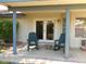 Covered patio with two rocking chairs at 4513 E Grovers Ave, Phoenix, AZ 85032