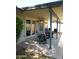 Covered patio with two rocking chairs and barbeque at 4513 E Grovers Ave, Phoenix, AZ 85032