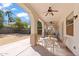 Relax under the covered patio with ceiling fans, perfect for outdoor dining at 4517 W Lodge Dr, Laveen, AZ 85339