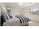 Cozy bedroom with natural light, neutral carpet, and a nice view at 4517 W Lodge Dr, Laveen, AZ 85339