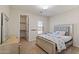 Comfortable bedroom with stylish silver furniture, carpet floors, and a walk-in closet at 4517 W Lodge Dr, Laveen, AZ 85339