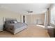 This main bedroom has neutral paint, carpet and a ceiling fan at 4517 W Lodge Dr, Laveen, AZ 85339