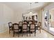 Elegant dining room with a large table, upholstered chairs, and an open view to the gourmet kitchen at 4517 W Lodge Dr, Laveen, AZ 85339