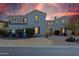 An elegant, multi-story home featuring architectural details and manicured landscaping creating a welcoming curb appeal at 4517 W Lodge Dr, Laveen, AZ 85339