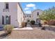 Charming stucco home featuring low-maintenance landscaping, a secure entry gate, and attractive architectural details at 4517 W Lodge Dr, Laveen, AZ 85339