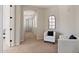 Bright hallway with white furniture and doors and an arched window for natural light at 4517 W Lodge Dr, Laveen, AZ 85339