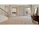 Bright and airy living room with large windows, neutral walls, and an open floor plan at 4517 W Lodge Dr, Laveen, AZ 85339
