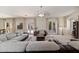 Comfortable living room features neutral tones, plush seating, and access to outdoor space at 4517 W Lodge Dr, Laveen, AZ 85339
