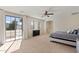 Large bedroom featuring carpet floors, a ceiling fan, access to a patio and a view at 4517 W Lodge Dr, Laveen, AZ 85339