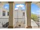 Exterior view through the beams to another unit with a fireplace and chimney at 4517 W Lodge Dr, Laveen, AZ 85339