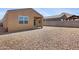 Low maintenance gravel backyard with patio space is ready for your personal touch at 4628 W Greenleaf Dr, San Tan Valley, AZ 85144