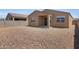 Spacious gravel backyard offers privacy with block fencing and potential for customization at 4628 W Greenleaf Dr, San Tan Valley, AZ 85144