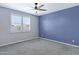 Modern bedroom featuring a large window with shutters and two-tone walls at 4628 W Greenleaf Dr, San Tan Valley, AZ 85144