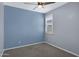 Bedroom featuring a window with shutters and two-tone walls, with a ceiling fan at 4628 W Greenleaf Dr, San Tan Valley, AZ 85144