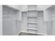 Well-organized walk-in closet with shelving and rods for ample storage space at 4628 W Greenleaf Dr, San Tan Valley, AZ 85144
