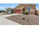 Lovely single-story home featuring desert landscaping and an attached two-car garage at 4628 W Greenleaf Dr, San Tan Valley, AZ 85144