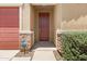 Close-up of the front entrance with stone accents and a classic, wood-stained front door at 4628 W Greenleaf Dr, San Tan Valley, AZ 85144