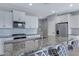 Modern kitchen featuring granite countertops, stainless steel appliances, and white cabinetry at 4628 W Greenleaf Dr, San Tan Valley, AZ 85144