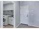 Laundry room with sink, counter, washer and dryer, shelves, and a door at 4628 W Greenleaf Dr, San Tan Valley, AZ 85144